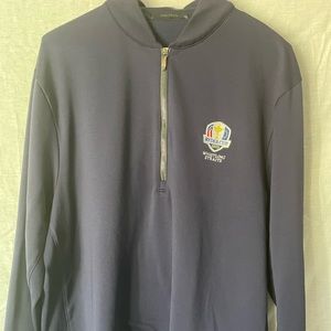 Three quarter zip long sleeve golf shirt w/ 2020 Ryder Cup logo.